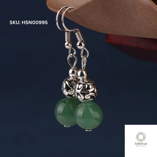 Green Beaded Dangle Earrings with Intricate Silver Charms