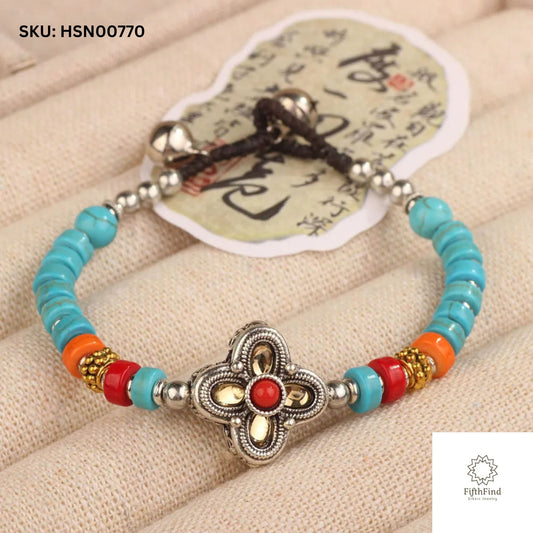 Turquoise Bracelet with Silver Floral Charm and Red Beads